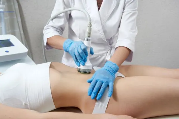 Lost the Weight but Not the Loose Skin? 2 woman having HIFU treatment on her stomach to combat loose skin Avonmouth following weight loss